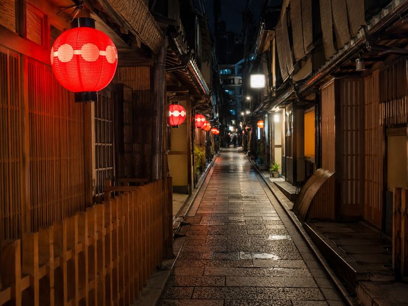 Lantern-lit streets of Kyoto at night during the Gion Matsuri festival season