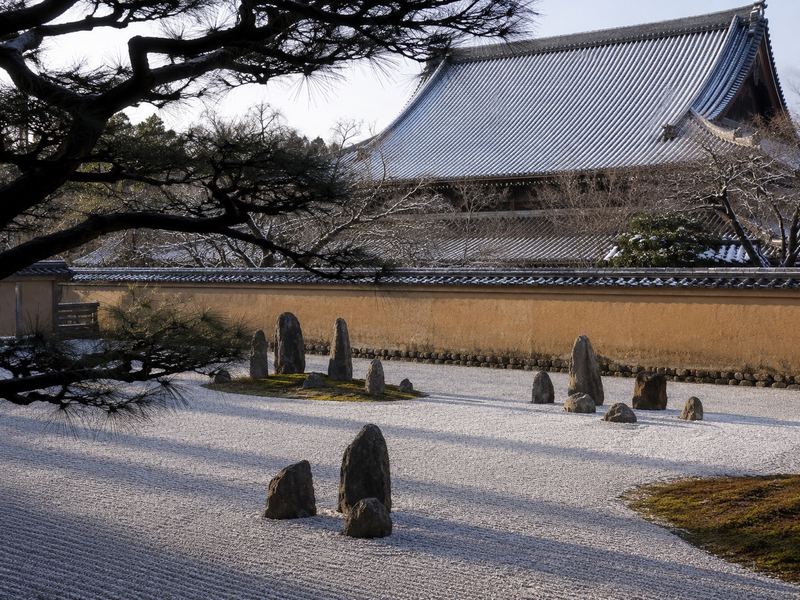 A Kyoto Zen temple garden in full autumn colour, seen in the early morning